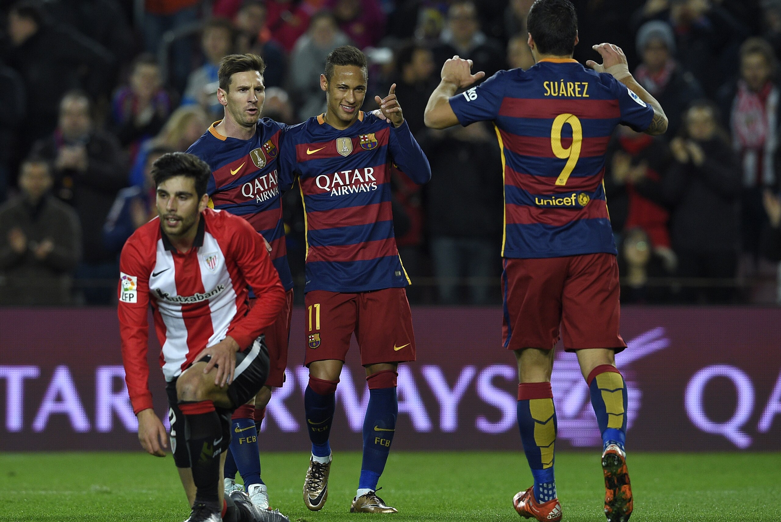 Barcelona's Brazilian forward Neymar (2ndR) celebrates with Barcelona's Argentinian forward Lionel Messi (2ndL) and Barcelona's Uruguayan forward Luis Suarez (R) after scoring during the Spanish league football match FC Barcelona vs Athletic Club Bilbao at the Camp Nou stadium in Barcelona on January 17, 2016.   AFP PHOTO/ LLUIS GENE / AFP / LLUIS GENE        (Photo credit should read LLUIS GENE/AFP/Getty Images)
