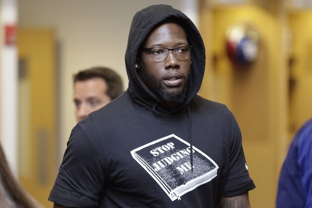New York Giants NFL football player Jason Pierre-Paul walks through the team locker room in East Rutherford, N.J., Monday, Jan. 4, 2016. The final game for the Giants was much like many others this season. New York had its chances and squandered them in a 35-50 loss to the Philadelphia Eagles on Sunday. (AP Photo/Seth Wenig)