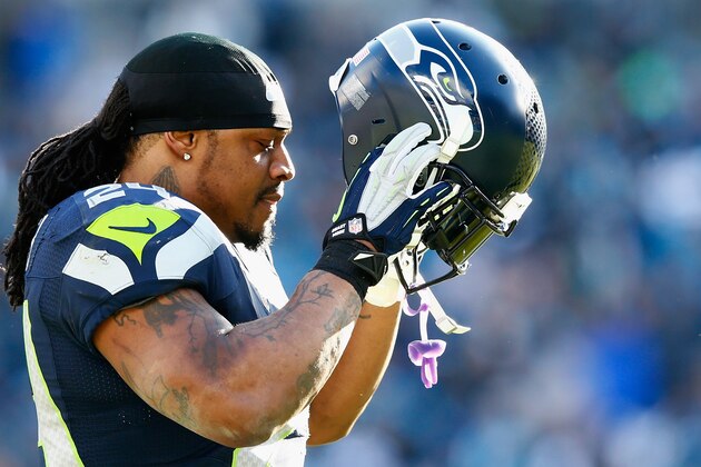 CHARLOTTE, NC - JANUARY 17:  Marshawn Lynch #24 of the Seattle Seahawks looks on during the third quarter of the NFC Divisional Playoff Game against the Carolina Panthers at Bank of America Stadium on January 17, 2016 in Charlotte, North Carolina.  (Photo by Jamie Squire/Getty Images)