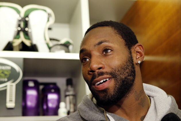 New York Jets cornerback Antonio Cromartie (31) stands by his locker during a press conference at the Jets practice facility Wednesday, Dec. 30, 2015, in Florham Park, NJ. The Jets are preparing for Sunday's game against the Buffalo Bills and former coach, Rex Ryan. If they defeat the Bills, they'll earn a wild card spot in the playoffs. (AP Photo/Kathy Willens)