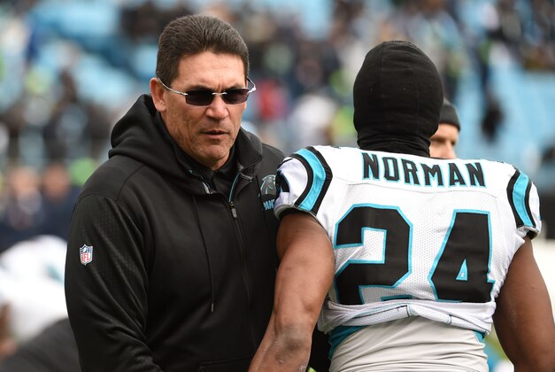 Jan 17, 2016; Charlotte, NC, USA; Carolina Panthers head coach Ron Rivera talks to Josh Norman (24) prior to facing the Seattle Seahawks in the NFC Divisional round playoff game at Bank of America Stadium. Mandatory Credit: Kirby Lee-USA TODAY Sports