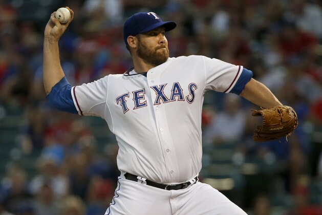 Texas Rangers starting pitcher Colby Lewis works against the Detroit Tigers in the first inning of a baseball game Monday Sept. 28, 2015, in Arlington, Texas. (AP Photo/Ron Jenkins)