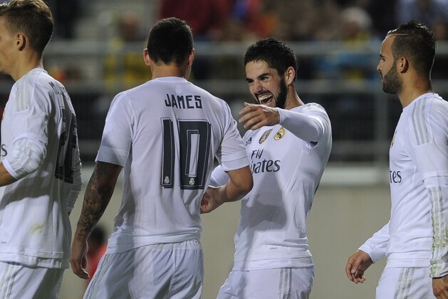 Real Madrid's midfielder Isco (2R) celebrates after scoring with Real Madrid's Colombian midfielder James Rodriguez (2L) during the Spanish Copa del Rey (King's Cup) football match Cadiz CF vs Real Madrid at the Ramon de Carranza in Cadiz on December 2, 2015.  AFP PHOTO / CRISTINA QUICLER / AFP / CRISTINA QUICLER        (Photo credit should read CRISTINA QUICLER/AFP/Getty Images)