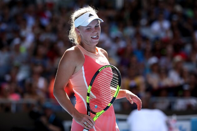 MELBOURNE, AUSTRALIA - JANUARY 18: Caroline Wozniacki of Denmark reacts in her first round match against Yulia Putintseva of Kazakhstan during day one of the 2016 Australian Open at Melbourne Park on January 18, 2016 in Melbourne, Australia. (Photo by Michael Dodge/Getty Images) MELBOURNE, AUSTRALIA - JANUARY 18: Caroline Wozniacki of Denmark reacts in her first round match against Yulia Putintseva of Kazakhstan during day one of the 2016 Australian Open at Melbourne Park on January 18, 2016 in Melbourne, Australia. (Photo by Michael Dodge/Getty Images)