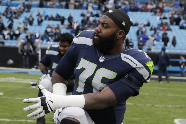 Seattle Seahawks tackle Russell Okung (76) warms up before the first half of an NFL divisional playoff football game between the Carolina Panthers and the Seattle Seahawks, Sunday, Jan. 17, 2016, in Charlotte, N.C. (AP Photo/Bob Leverone)