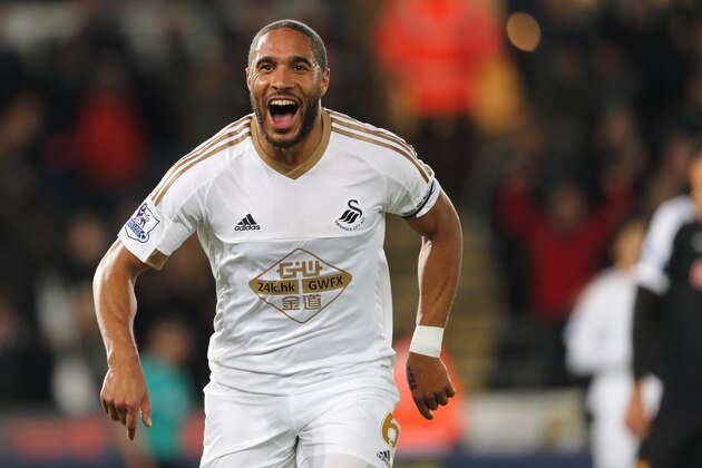 SWANSEA, WALES - JANUARY 18:  Ashley Williams of Swansea City celebrates after scoring a goal to make it 1-0 during the Barclays Premier League match between Swansea City and Watford at the Liberty Stadium on January 18, 2016 in Swansea, Wales.  (Photo by Matthew Ashton - AMA/Sports Photo Agency)