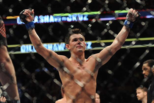 Jan 17, 2016; Boston, MA, USA;  Dominick Cruz (blue) celebrates his win over TJ Dillashaw (not pictured) in a world bantamweight championship bout at UFC Fight Night at the TD Garden.  Cruz won after five rounds by split decision. Mandatory Credit: Bob DeChiara-USA TODAY Sports