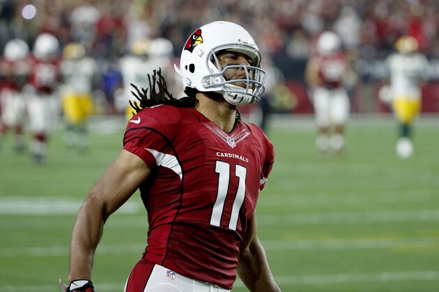 Arizona Cardinals wide receiver Larry Fitzgerald (11) celebrates a catch against the Green Bay Packers during the second half of an NFL divisional playoff football game, Saturday, Jan. 16, 2016, in Glendale, Ariz. (AP Photo/Ross D. Franklin)