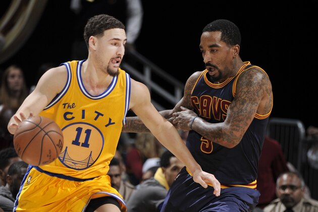 CLEVELAND, OH - JANUARY 18: Klay Thompson #11 of the Golden State Warriors drives the basket against J.R. Smith #5 of the Cleveland Cavaliers during the game on January 18, 2016 at Quicken Loans Arena in Cleveland, Ohio. NOTE TO USER: User expressly acknowledges and agrees that, by downloading and or using this Photograph, user is consenting to the terms and conditions of the Getty Images License Agreement. Mandatory Copyright Notice: Copyright 2016 NBAE (Photo by David Liam Kyle/NBAE via Getty Images)