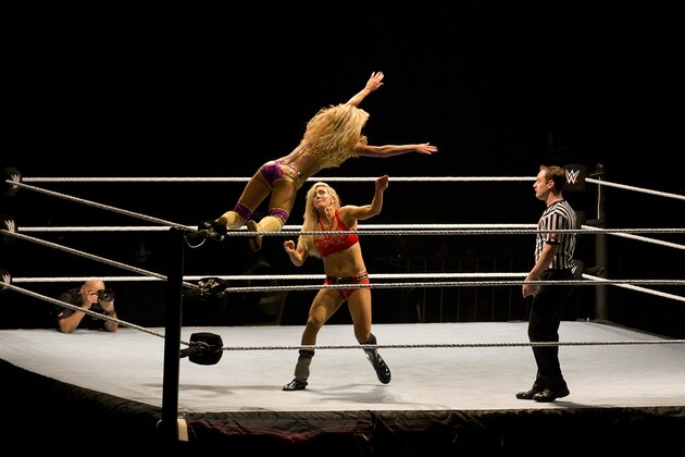WWE wrestler Summer Rae, left, jumps over Charlotte during WWE Live India Tour, in New Delhi, Friday, Jan. 15, 2016. WWE returned to Indian after a gap of 13 years to entertain their fans. (AP Photo/Manish Swarup)