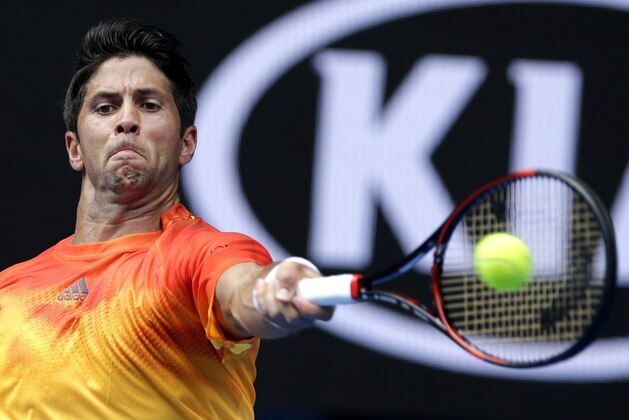 Fernando Verdasco of Spain hits a return to compatriot Rafael Nadal during their first round match at the Australian Open tennis championships in Melbourne, Australia, Tuesday, Jan. 19, 2016.(AP Photo/Aaron Favila)
