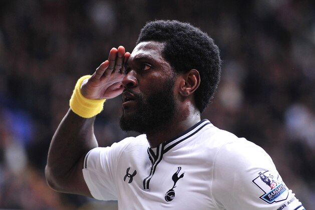 Tottenham Hotspur's Togolese striker Emmanuel Adebayor celebrates after scoring from a penalty during the English Premier League football match between Tottenham Hotspur and Aston Villa at White Hart Lane in London on May 11, 2014.  AFP PHOTO/CARL COURT - RESTRICTED TO EDITORIAL USE. No use with unauthorized audio, video, data, fixture lists, club/league logos or live services. Online in-match use limited to 45 images, no video emulation. No use in betting, games or single club/league/player publications.        (Photo credit should read CARL COURT/AFP/Getty Images)