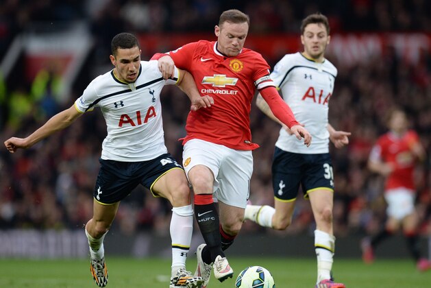 Manchester United's English striker Wayne Rooney (C) is challenged by Tottenham Hotspur's French midfielder Nabil Bentaleb (L) as Tottenham Hotspur's English midfielder Ryan Mason (R) looks on during the English Premier League football match between Manchester United and Tottenham Hotspur at Old Trafford in Manchester, North West England on March 15, 2015. AFP PHOTO / OLI SCARFF

RESTRICTED TO EDITORIAL USE. NO USE WITH UNAUTHORIZED AUDIO, VIDEO, DATA, FIXTURE LISTS, CLUB/LEAGUE LOGOS OR LIVE SERVICES. ONLINE IN-MATCH USE LIMITED TO 45 IMAGES, NO VIDEO EMULATION. NO USE IN BETTING, GAMES OR SINGLE CLUB/LEAGUE/PLAYER PUBLICATIONS.        (Photo credit should read OLI SCARFF/AFP/Getty Images)