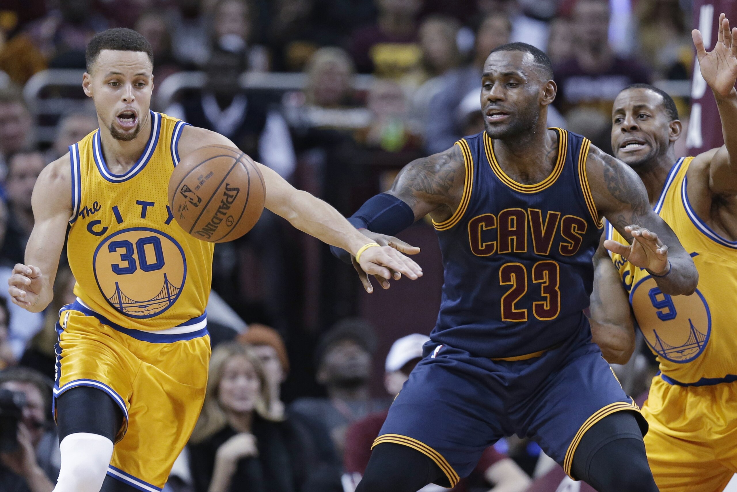 Golden State Warriors’ Stephen Curry (30) knocks the ball loose from Cleveland Cavaliers' LeBron James (23) in the first half of an NBA basketball game, Monday, Jan. 18, 2016, in Cleveland. Andre Iguodala (9) is at right. (AP Photo/Tony Dejak) Golden State Warriors’ Stephen Curry (30) knocks the ball loose from Cleveland Cavaliers' LeBron James (23) in the first half of an NBA basketball game, Monday, Jan. 18, 2016, in Cleveland. Andre Iguodala (9) is at right. (AP Photo/Tony Dejak)