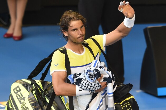 Spain's Rafael Nadal gestures as he leaves the court after defeat in his men's singles match against compatriot Fernando Verdasco on day two of the 2016 Australian Open tennis tournament in Melbourne on January 19, 2016. AFP PHOTO / WILLIAM WEST-- IMAGE RESTRICTED TO EDITORIAL USE - STRICTLY NO COMMERCIAL USE / AFP / WILLIAM WEST        (Photo credit should read WILLIAM WEST/AFP/Getty Images)