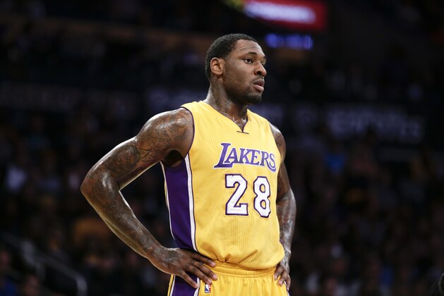 Los Angeles Lakers' Tarik Black looks on during the first half of an NBA preseason basketball game against the Portland Trail Blazers, Monday, Oct. 19, 2015, in Los Angeles. (AP Photo/Jae C. Hong)
