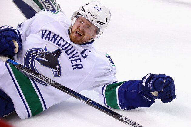 NEW YORK, NY - JANUARY 17:  Henrik Sedin #33 of the Vancouver Canucks shows the effect of a boarding major assessed to Mikhail Grabovski #84 of the New York Islanders during the first period at the Barclays Center on January 17, 2016 in the Brooklyn borough of New York City.  (Photo by Bruce Bennett/Getty Images)