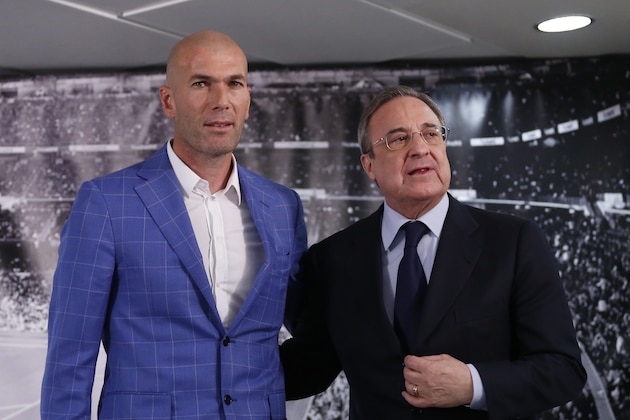 Real Madrid's President Florentino Perez, right, stands with newly appointed coach Zinedine Zidane at the Santiago Bernabeu stadium in Madrid, Spain, Monday Jan. 4, 2016. Real Madrid has fired coach Rafael Benitez after seven months and replaced him with former player Zinedine Zidane a day after Madrid's 2-2 draw at Valencia deepened a crisis that started with an embarrassing 4-0 home loss to rival Barcelona in November. (AP Photo)
