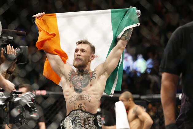 Conor McGregor reacts after defeating Jose Aldo during a featherweight championship mixed martial arts bout at UFC 194, Saturday, Dec. 12, 2015, in Las Vegas. (AP Photo/John Locher)
