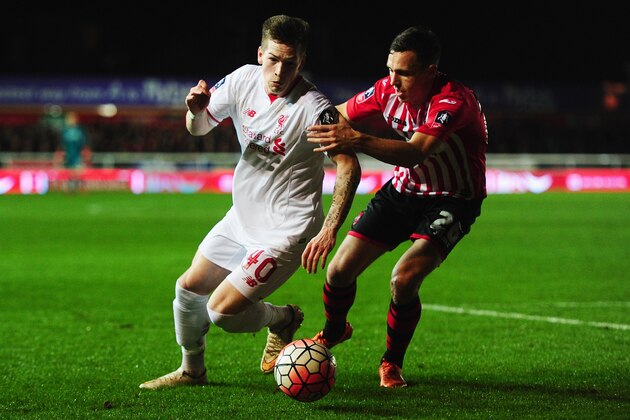 EXETER, ENGLAND - JANUARY 08:  Ryan Kent of Liverpool takes on Jordan Tillson of Exeter City during the Emirates FA Cup third round match between Exeter City and Liverpool at St James Park on January 8, 2016 in Exeter, England.  (Photo by Dan Mullan/Getty Images)