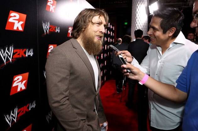 IMAGE DISTRIBUTED FOR 2K - WWE Superstar Daniel Bryan speaks to press at the WWE 2K14 press event, on Saturday, Aug. 17, 2013 in Los Angeles.  (Photo by Casey Rodgers/Invision for 2K/AP Images)