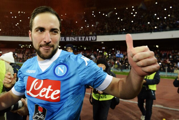Napoli's Gonzalo Higuain celebrates after scoring his second goal during a Serie A soccer match between Napoli and Sassuolo, at the San Paolo stadium in Naples, Italy, Saturday, Jan. 16, 2016. (AP Photo/Salvatore Laporta)