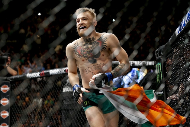 Conor McGregor reacts after defeating Jose Aldo during a featherweight  championship mixed martial arts bout at UFC 194, Saturday, Dec. 12, 2015, in Las Vegas. (AP Photo/John Locher)