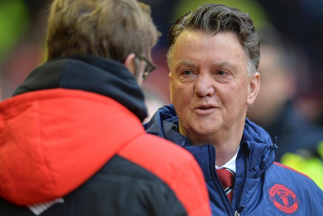 Liverpool's German manager Jurgen Klopp (L) greets Manchester United's Dutch manager Louis van Gaal (R) during the English Premier League football match between Liverpool and Manchester United at Anfield in Liverpool, northwest England, on January 17, 2016.  AFP PHOTO / PAUL ELLIS

RESTRICTED TO EDITORIAL USE. No use with unauthorized audio, video, data, fixture lists, club/league logos or 'live' services. Online in-match use limited to 75 images, no video emulation. No use in betting, games or single club/league/player publications. / AFP / PAUL ELLIS        (Photo credit should read PAUL ELLIS/AFP/Getty Images)