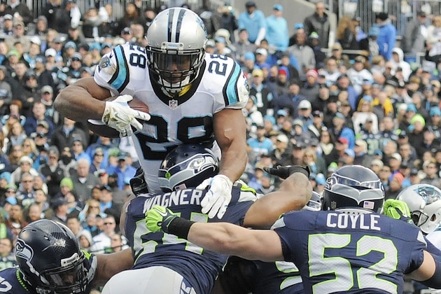 Carolina Panthers running back Jonathan Stewart (28) heads for the end zone for a touchdown against the Seattle Seahawks during the first half of an NFL divisional playoff football game, Sunday, Jan. 17, 2016, in Charlotte, N.C. (AP Photo/Mike McCarn)