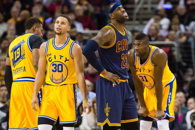 CLEVELAND, OH - JANUARY 18: Stephen Curry #30 of the Golden State Warriors and LeBron James #23 of the Cleveland Cavaliers react during the first half at Quicken Loans Arena on January 18, 2016 in Cleveland, Ohio. NOTE TO USER: User expressly acknowledges and agrees that, by downloading and/or using this photograph, user is consenting to the terms and conditions of the Getty Images License Agreement. Mandatory copyright notice. (Photo by Jason Miller/Getty Images)