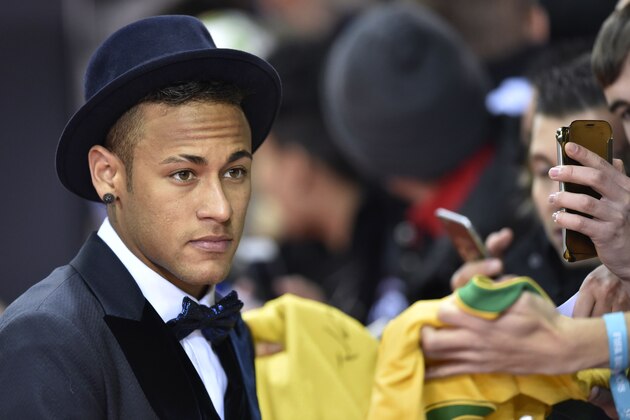 FC Barcelona and Brazils forward  Neymar poses on the red carpet as he arrives for the 2015 FIFA Ballon d'Or award ceremony at the Kongresshaus in Zurich on January 11, 2016. AFP PHOTO / MICHAEL BUHOLZER / AFP / MICHAEL BUHOLZER        (Photo credit should read MICHAEL BUHOLZER/AFP/Getty Images)
