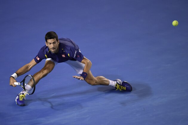 Serbia's Novak Djokovic plays a forehand return during men's singles match against France's Quentin Halys on day three of the 2016 Australian Open tennis tournament in Melbourne on January 20, 2016. AFP PHOTO / PETER PARKS-- IMAGE RESTRICTED TO EDITORIAL USE - STRICTLY NO COMMERCIAL USE / AFP / PETER PARKS        (Photo credit should read PETER PARKS/AFP/Getty Images)
