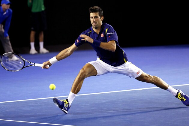 Novak Djokovic of Serbia reaches for a forehand return to Quentin Halys of France during their second round match at the Australian Open tennis championships in Melbourne, Australia, Wednesday, Jan. 20, 2016.(AP Photo/Vincent Thian)
