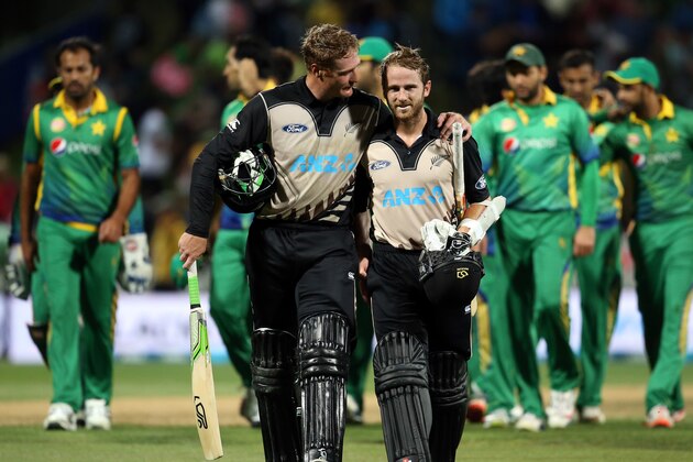 Martin Guptill (front L) and Kane Williamson (front R) of New Zealand celebrate winning the second Twenty20 cricket match between New Zealand and Pakistan at Seddon Park in Hamilton on January 17, 2016.   AFP PHOTO / MICHAEL BRADLEY / AFP / MICHAEL BRADLEY        (Photo credit should read MICHAEL BRADLEY/AFP/Getty Images)