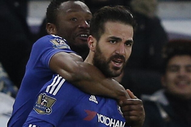 Chelsea's Spanish midfielder Cesc Fabregas (R) celebrates with Chelsea's Nigerian midfielder John Obi Mikel (L) after scoring Chelsea's second goal to equalise 2-2 during the English Premier League football match between Chelsea and Everton at Stamford Bridge in London on January 16, 2016. AFP PHOTO / ADRIAN DENNIS

RESTRICTED TO EDITORIAL USE. No use with unauthorized audio, video, data, fixture lists, club/league logos or 'live' services. Online in-match use limited to 75 images, no video emulation. No use in betting, games or single club/league/player publications. / AFP / ADRIAN DENNIS        (Photo credit should read ADRIAN DENNIS/AFP/Getty Images)