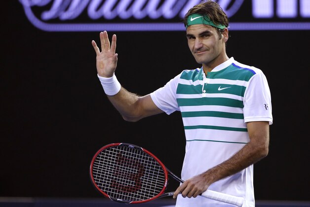 Roger Federer of Switzerland waves after defeating Nikoloz Basilashvili of Georgia during their first round match at the Australian Open tennis championships in Melbourne, Australia, Monday, Jan. 18, 2016.(AP Photo/Vincent Thian)