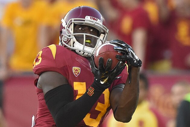 Southern California tight end Bryce Dixon catches a touchdown pass during the second half of an NCAA college football game against Fresno State, Saturday, Aug. 30, 2014, in Los Angeles.  USC won 52-13. (AP Photo/Mark J. Terrill)