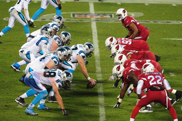 CHARLOTTE, NC - JANUARY 3: Cam Newton #1 of the Carolina Panthers takes a snap against the Arizona Cardinals during the NFC Wild Card Playoff game on January 3, 2015 at Bank of America Stadium in Charlotte, North Carolina.  (Photo by Scott Cunningham/Getty Images)