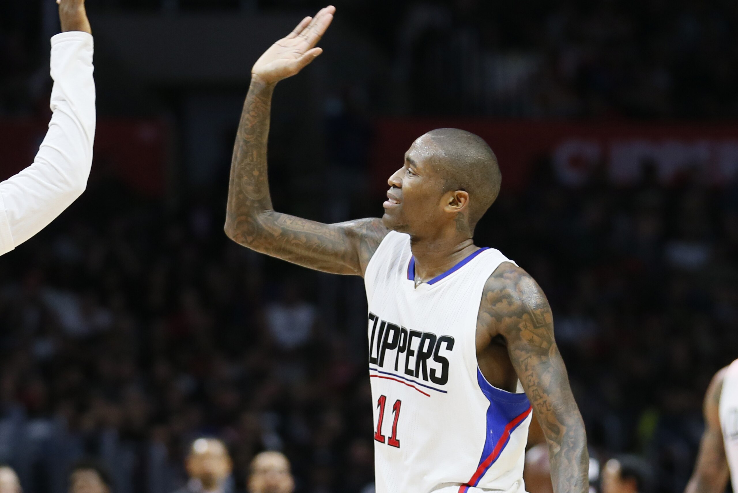 Los Angeles Clippers' Chris Paul, left, congratulates Jamal Crawford, right, after Crawford made a 3-pointer against the Miami Heat during the second half of an NBA basketball game, Wednesday, Jan. 13, 2016, in Los Angeles. The Clippers won 104-90. (AP Photo/Danny Moloshok)