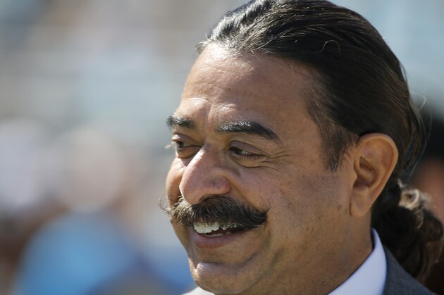 Jacksonville Jaguars team owner Shad Khan watches players warm up before an NFL football game against the Cleveland Browns in Jacksonville, Fla., Sunday, Oct. 19, 2014. (AP Photo/Stephen B. Morton)