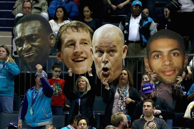 CHARLOTTE, NC - JANUARY 18:  Fans of the Charlotte Hornets cheer on their team in double overtime during their game against the Utah Jazz at Time Warner Cable Arena on January 18, 2016 in Charlotte, North Carolina.  NOTE TO USER: User expressly acknowledges and agrees that, by downloading and or using this photograph, User is consenting to the terms and conditions of the Getty Images License Agreement.  (Photo by Streeter Lecka/Getty Images)
