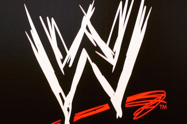 NEW YORK - MARCH 18:  The World Wrestling Entertainment logo hangs on a wall at a media conference announcing the all-star lineup of WWE WrestleMania XIX at ESPN Zone in Times Square March 18, 2003 in New York City.  (Photo by Mark Mainz/Getty Images)