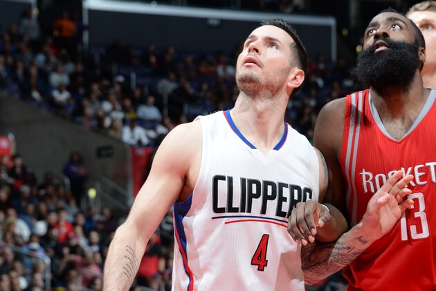 LOS ANGELES, CA - JANUARY 18: J.J. Redick #4 of the Los Angeles Clippers looks for the rebound against James Harden #13 of the Houston Rockets during the game on January 18, 2016 at STAPLES Center in Los Angeles, California. NOTE TO USER: User expressly acknowledges and agrees that, by downloading and or using this Photograph, user is consenting to the terms and conditions of the Getty Images License Agreement. Mandatory Copyright Notice: Copyright 2016 NBAE (Photo by Andrew Bernstein/NBAE via Getty Images)