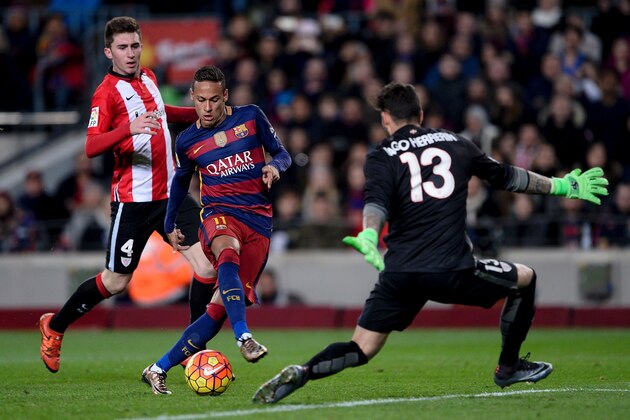 Barcelona's Brazilian forward Neymar (C) vies with Athletic Bilbao's French defender Aymeric Laporte (L) and Athletic Bilbao's goalkeeper Iago Herrerin duringthe Spanish league football match FC Barcelona vs Athletic Club Bilbao at the Camp Nou stadium in Barcelona on January 17, 2016.   AFP PHOTO/ JOSEP LAGO / AFP / JOSEP LAGO        (Photo credit should read JOSEP LAGO/AFP/Getty Images)