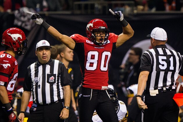 VANCOUVER, BC - NOVEMBER 30: Eric Rogers #80 of the Calgary Stampeders indicates a first down after making a catch during the first half of the 102nd Grey Cup Championship Game against the Hamilton Tiger-Cats at BC Place November 30, 2014 in Vancouver, British Columbia, Canada. (Photo by Rich Lam/Getty Images) VANCOUVER, BC - NOVEMBER 30: Eric Rogers #80 of the Calgary Stampeders indicates a first down after making a catch during the first half of the 102nd Grey Cup Championship Game against the Hamilton Tiger-Cats at BC Place November 30, 2014 in Vancouver, British Columbia, Canada. (Photo by Rich Lam/Getty Images)