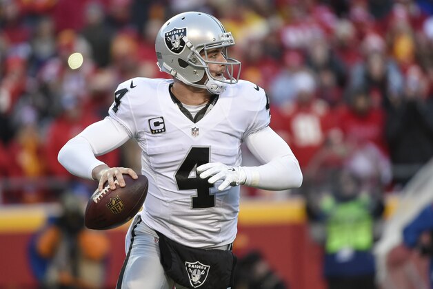 Oakland Raiders quarterback Derek Carr (4) looks to throw against the Kansas City Chiefs during the first half of their NFL football game in Kansas City, Mo., Sunday, Jan, 3, 2016. (AP Photo/Reed Hoffmann)