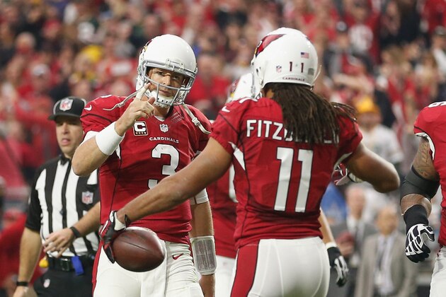 GLENDALE, AZ - DECEMBER 27: Wide receiver Larry Fitzgerald #11 and quarterback Carson Palmer #3 of the Arizona Cardinals celebrate after Fitzgerald scored a 3 yard touchdown in the second quarter of the NFL game against the Green Bay Packers at the University of Phoenix Stadium on December 27, 2015 in Glendale, Arizona.  (Photo by Christian Petersen/Getty Images)