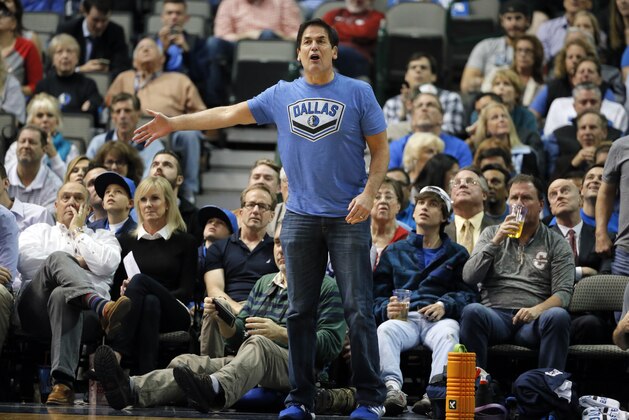 Dallas Mavericks team owner Mark Cuban shouts in the direction of an official during an NBA basketball game against the Phoenix Suns on Monday, Dec. 14, 2015, in Dallas. (AP Photo/Tony Gutierrez)