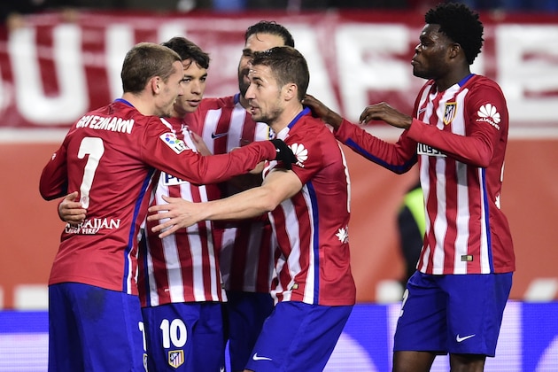 Atletico Madrid players celebrate a goal during the Spanish Copa del Rey (King's Cup) round of 16 second leg football match Club Atletico de Madrid vs CF Rayo Vallecano at Vicente Calderon stadium in Madrid on January 14, 2016.  AFP PHOTO / JAVIER SORIANO / AFP / JAVIER SORIANO        (Photo credit should read JAVIER SORIANO/AFP/Getty Images)