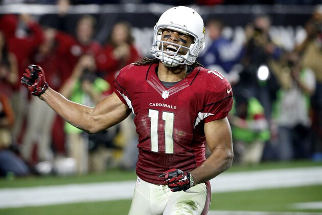 Arizona Cardinals wide receiver Larry Fitzgerald (11) celebrates his catch in the red zone to set up a game winning touchdown against the Green Bay Packers during the second half of an NFL divisional playoff football game, Saturday, Jan. 16, 2016, in Glendale, Ariz. The Cardinals won 26-20 in overtime. (AP Photo/Ross D. Franklin)